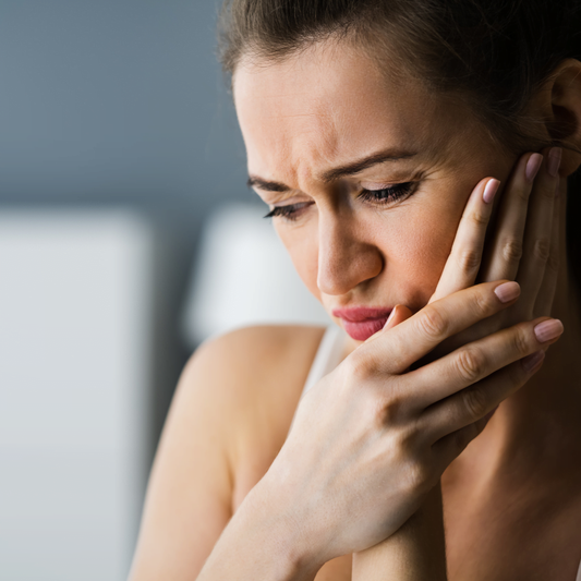 why are my teeth sore when I wake up?